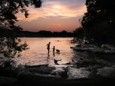 Mother and child playing in lake at sunset (C) Carrell Grigsby Photography